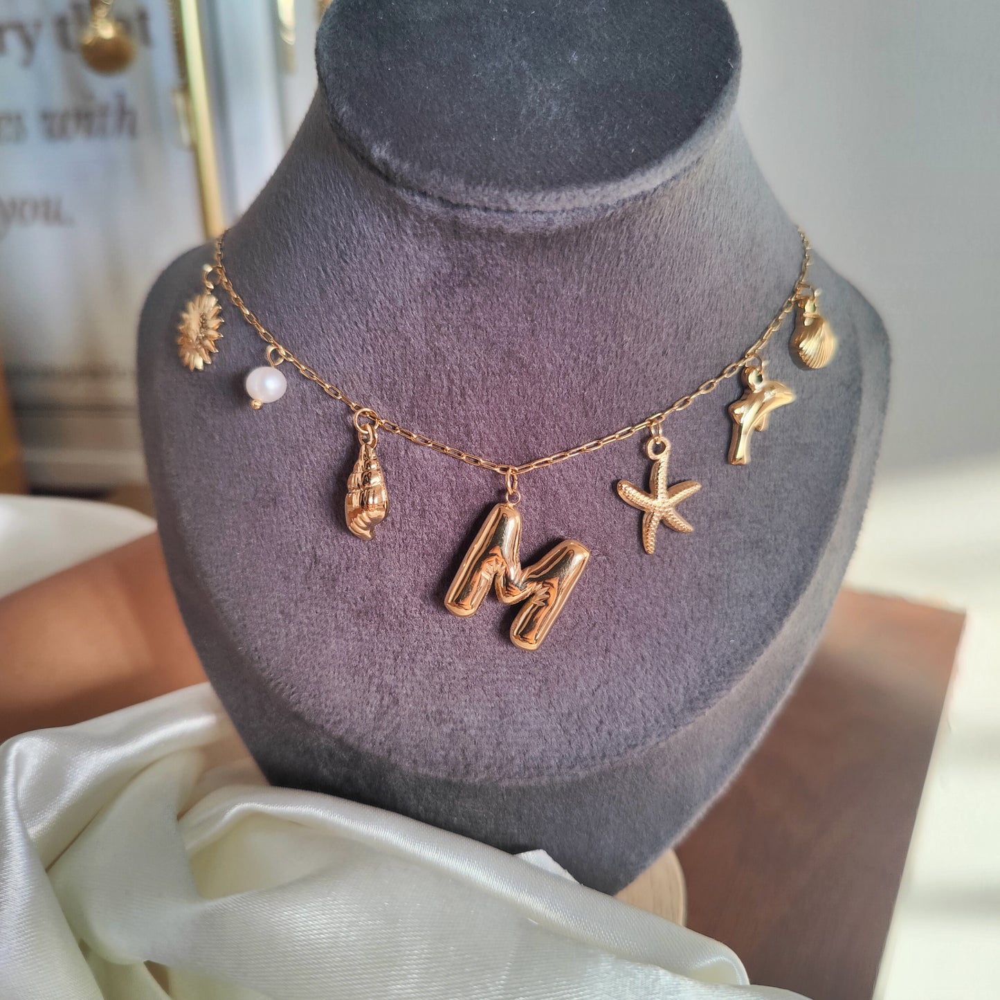 Initial charm necklaces