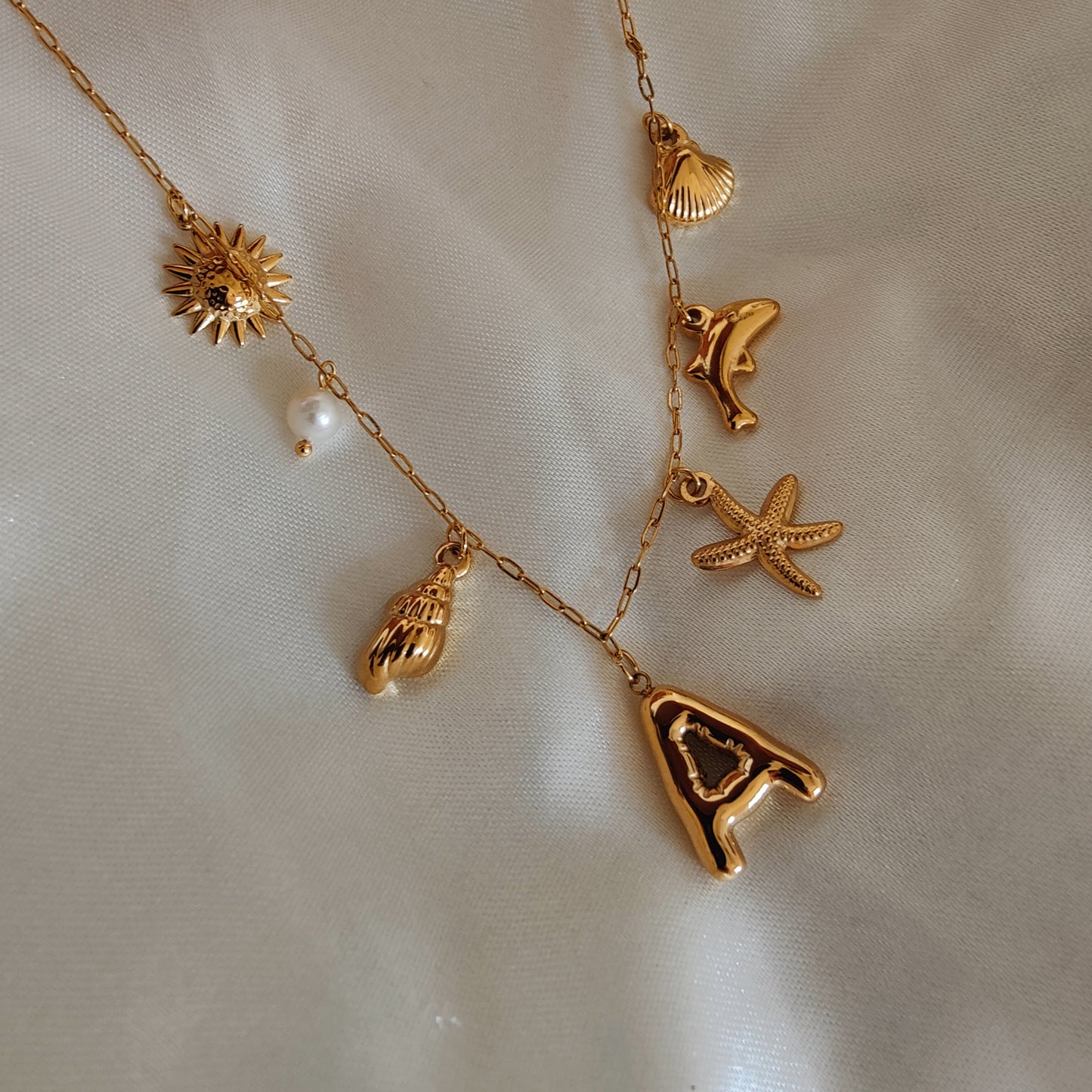 Initial charm necklaces