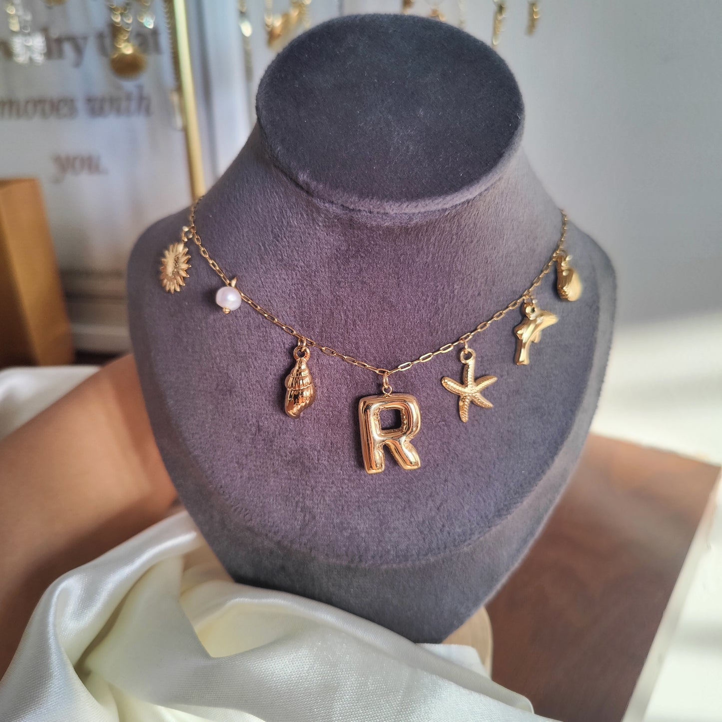 Initial charm necklaces