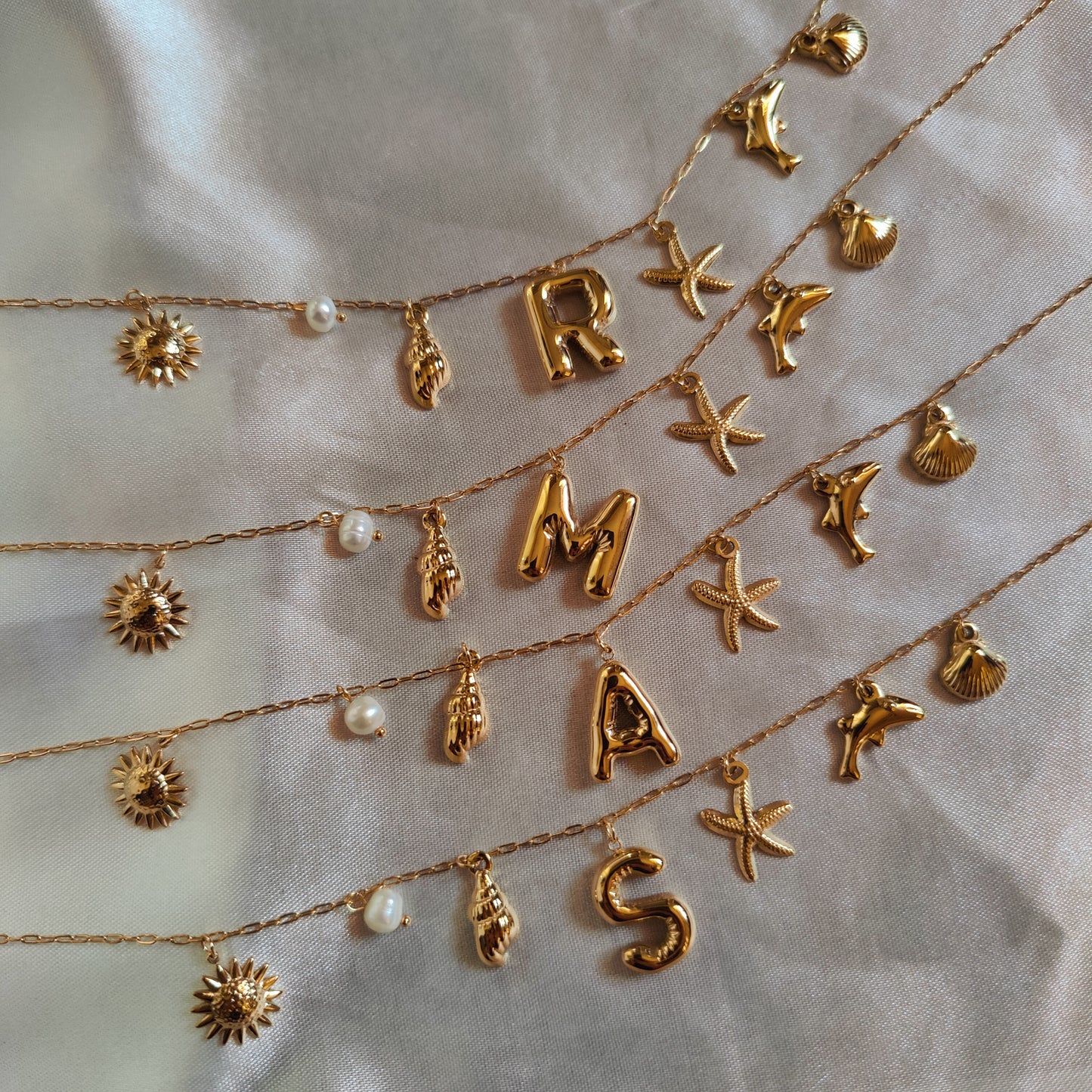 Initial charm necklaces