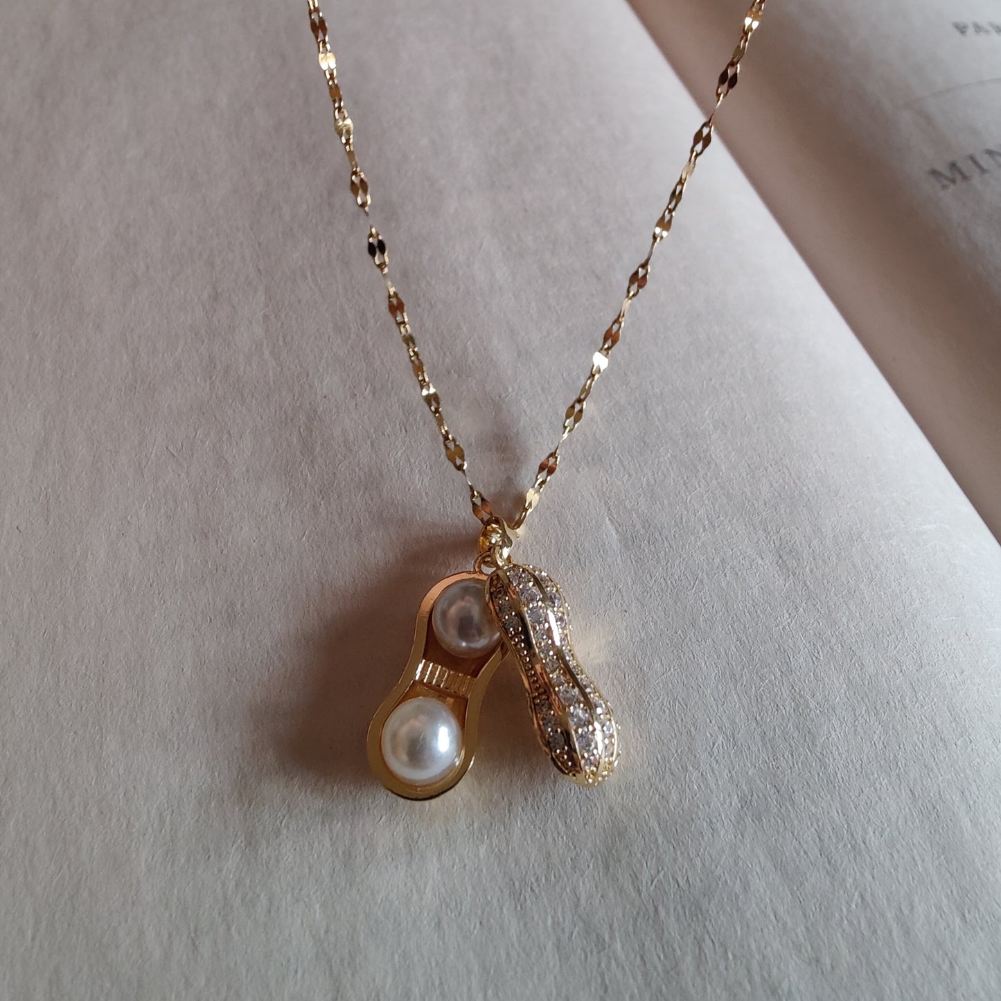 Openable peanut neckpiece