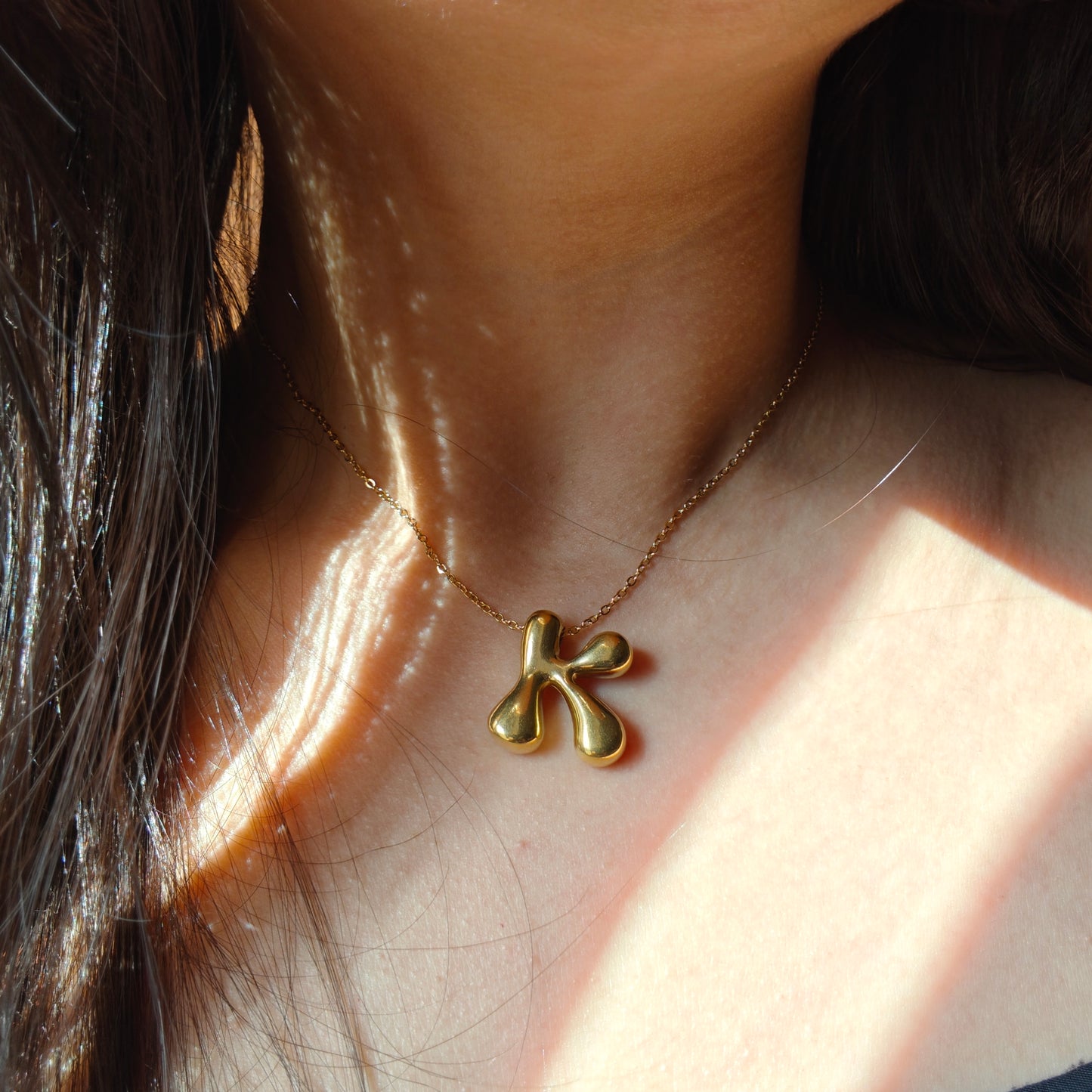 Bubble initial neckpieces