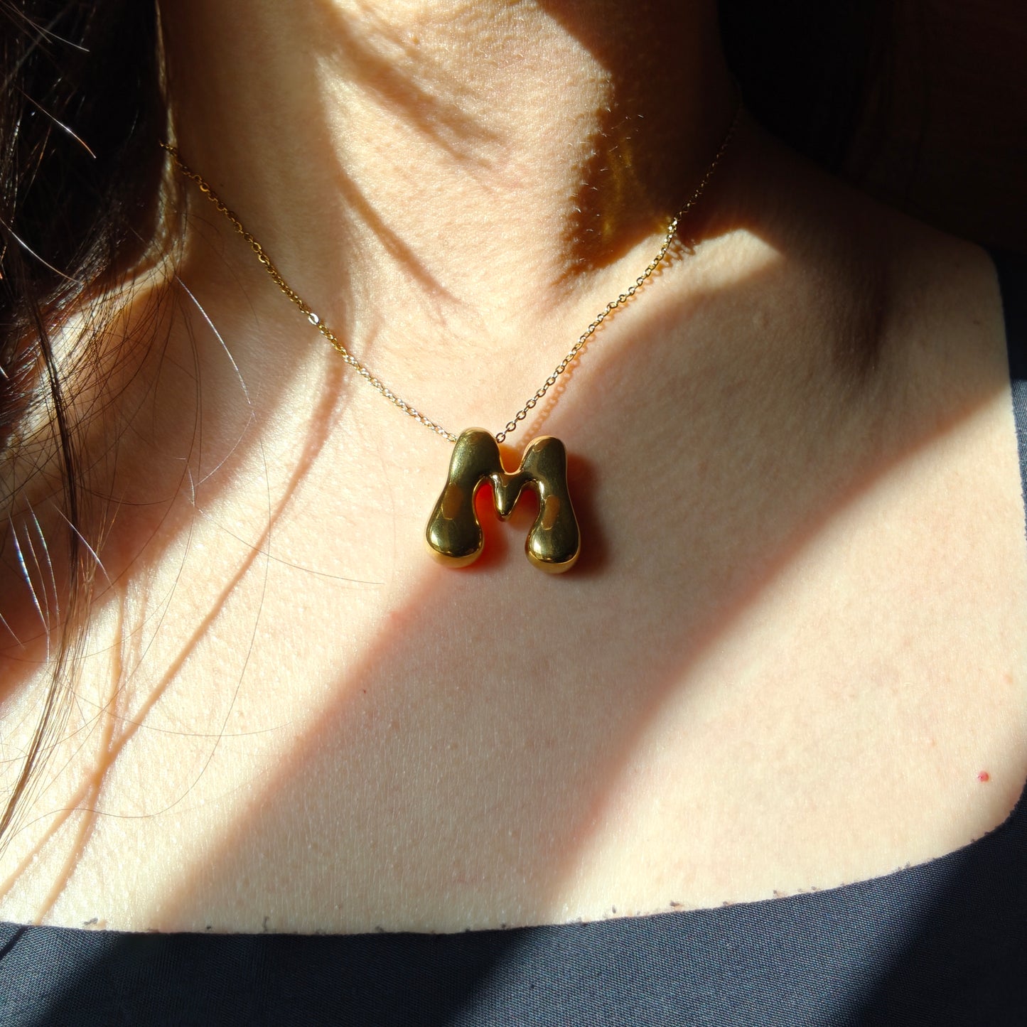 Bubble initial neckpieces