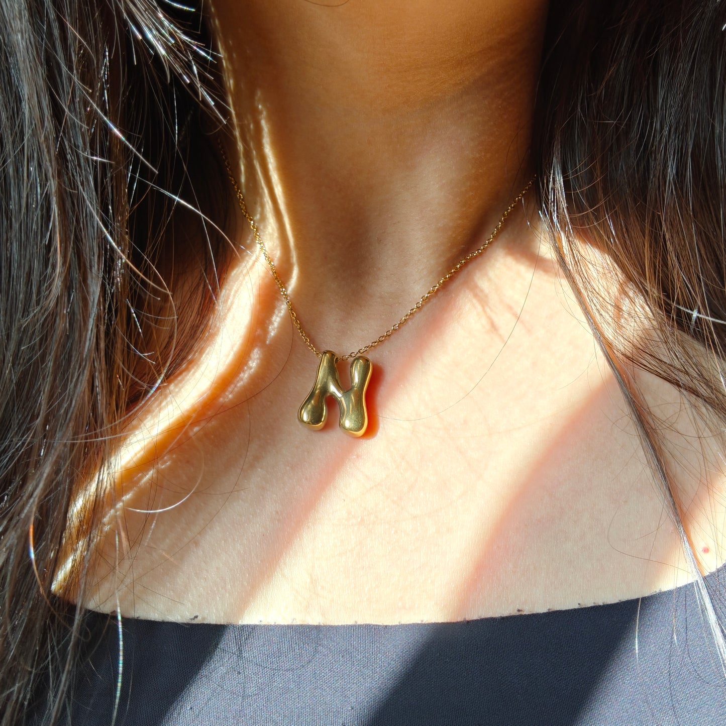 Bubble initial neckpieces