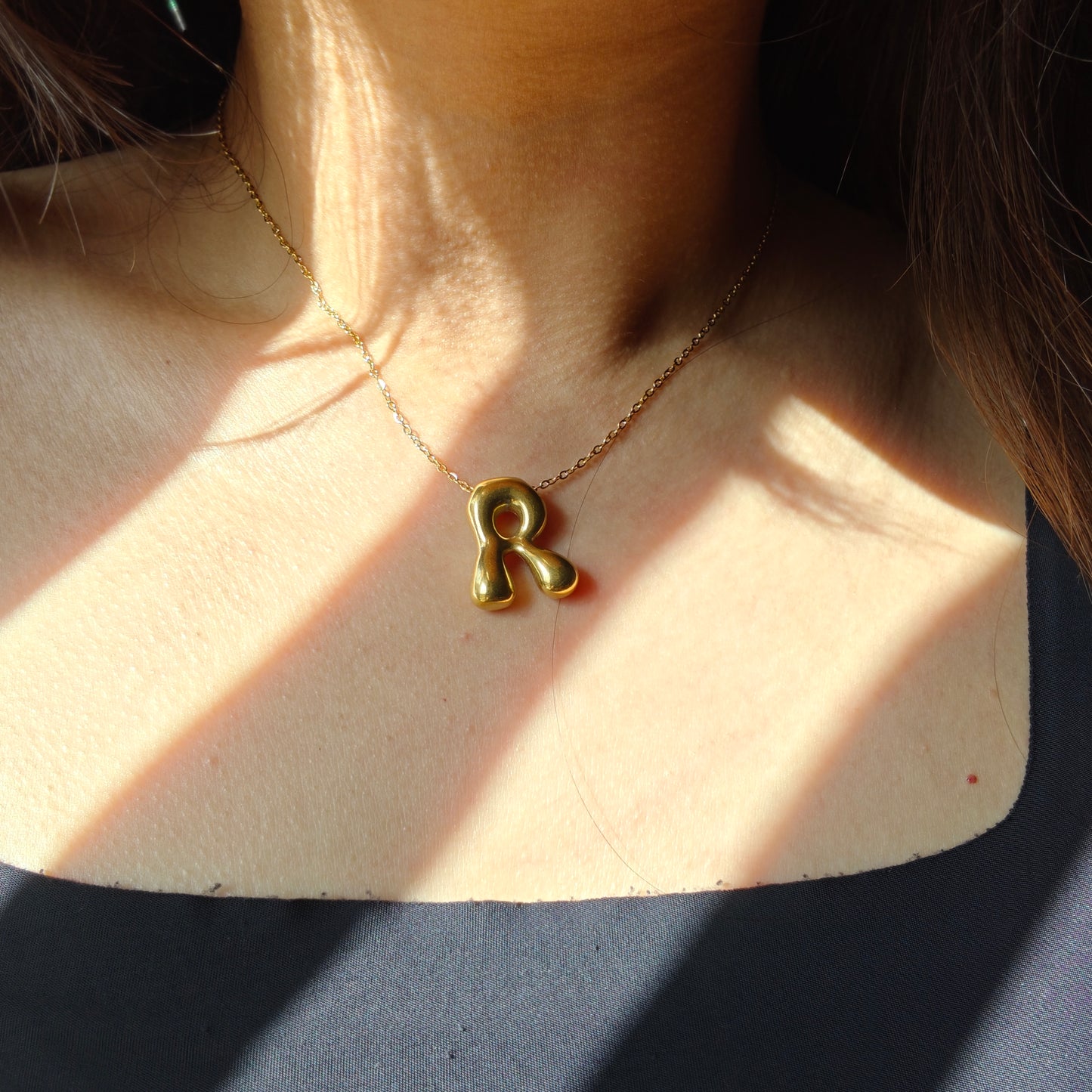 Bubble initial neckpieces