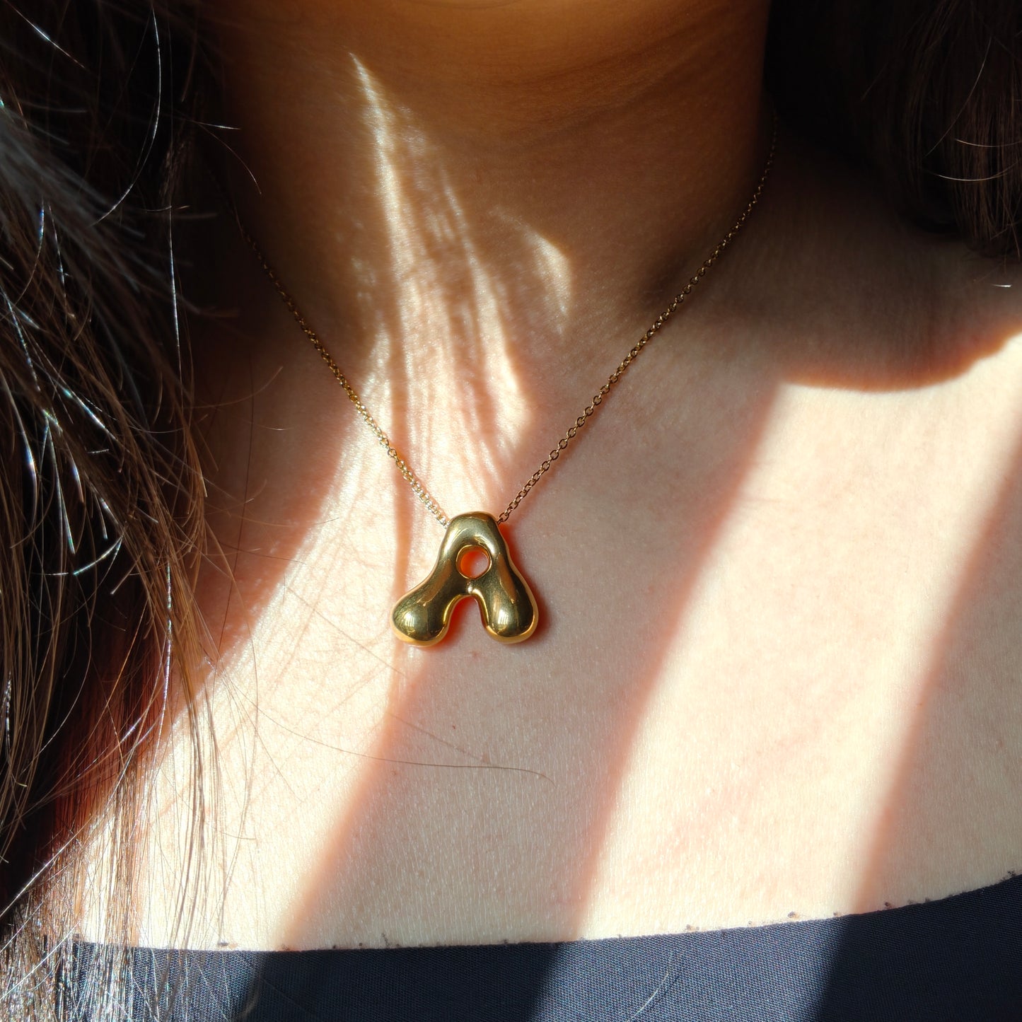 Bubble initial neckpieces