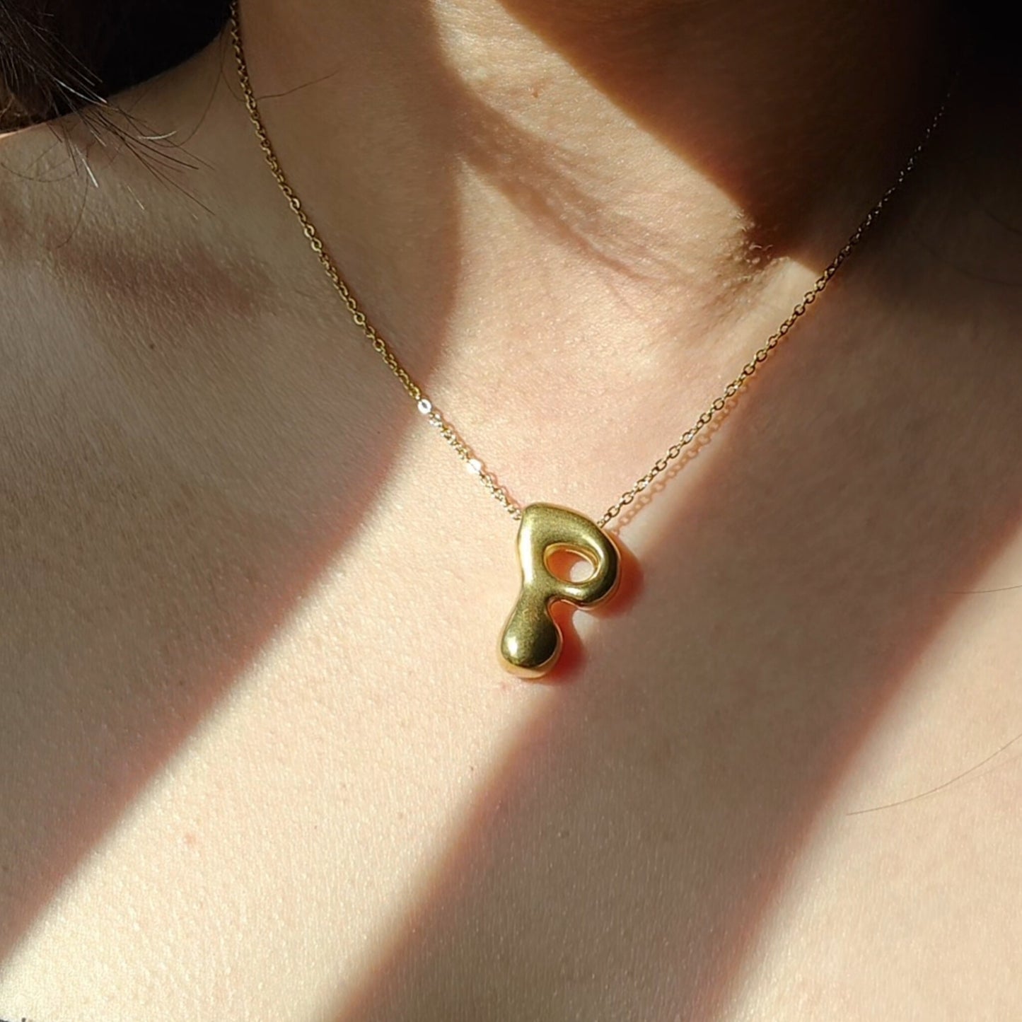 Bubble initial neckpieces