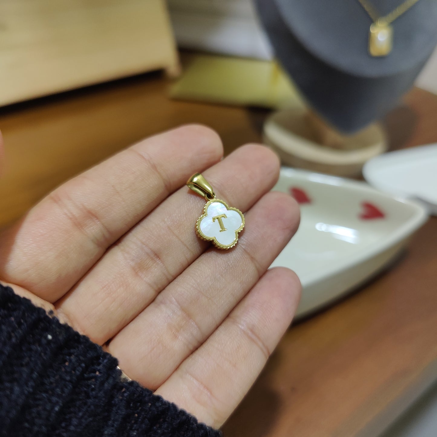 Initial T clover charm