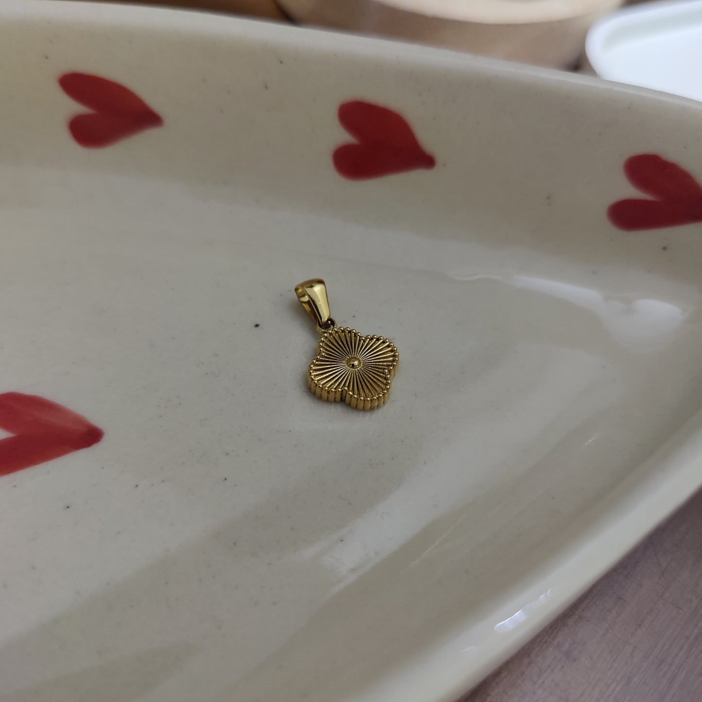 Initial T clover charm