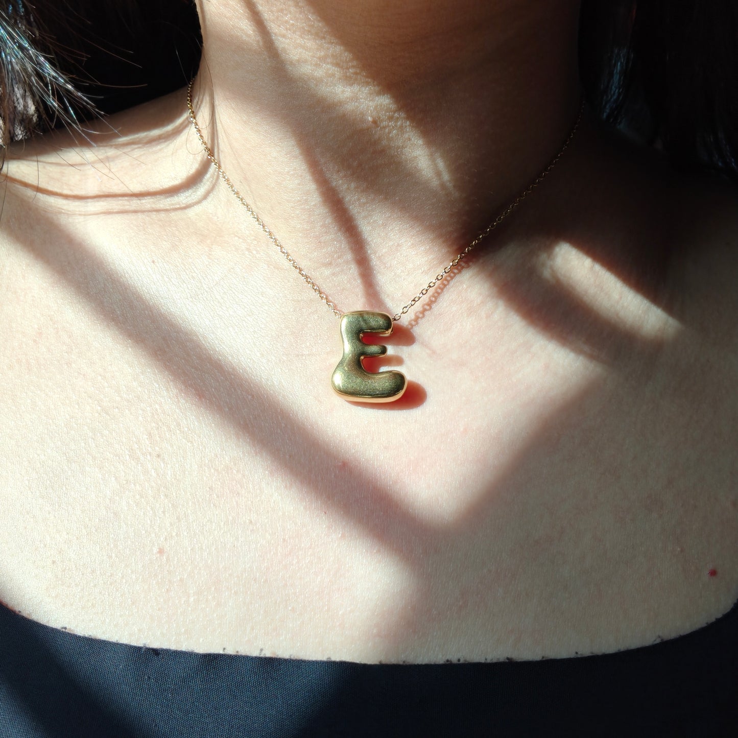 Bubble initial neckpieces