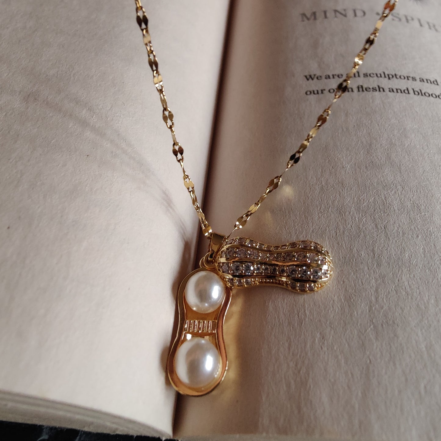 Openable peanut neckpiece